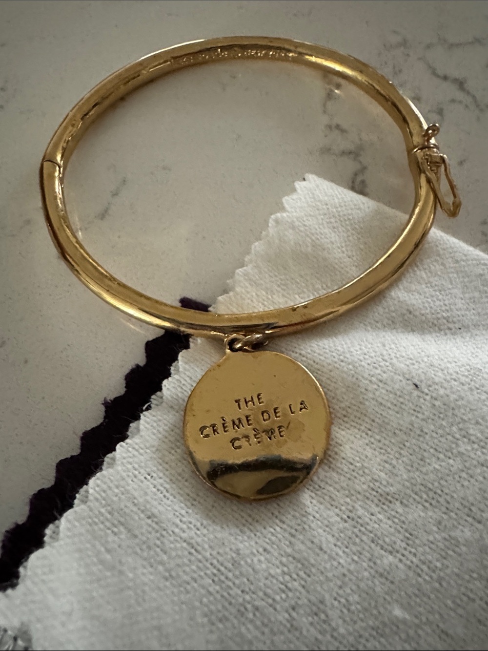 Kate Spade Gold Tone Bangle Bracelet with Cream Disc Charm - Picture 2 of 2